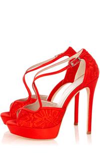 Attire. We love a pop of colour peeping out beneath a wedding dress. Dare to go red and these sandal
