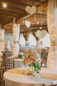 Reception Decor, Gold and white rustic colours. Heart homemade mobiles.