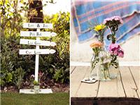 Flowers in different heights of glassware