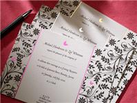 Stationery. An elegant gatefold invitation with the silver raised monogram on the front complimented