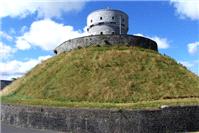 Miscellaneous. The Millmount 'cup & saucer' tower in Drogheda. The Martello tower stands on the myth